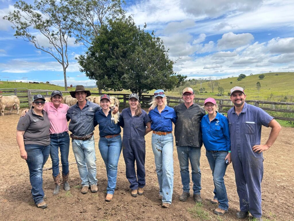Group of ACV members in field workshop